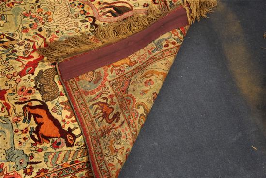 An early 20th century Kirman hunting rug, 6ft 5in by 4ft 2in.